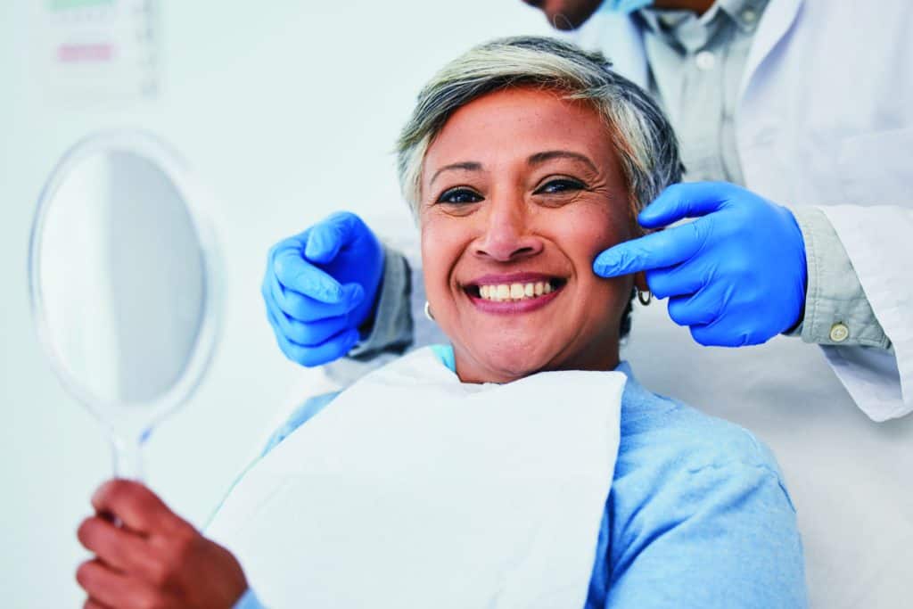 Happy senior woman during dental appointment